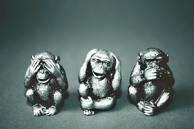 grayscale-photography-of-three-wise-monkey-figurines-