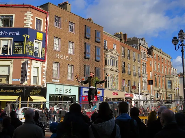 Busker juggling on a unicycle in Dublin in February