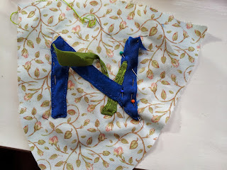 N for Narcissus (as a daffodil) in progress, N part sewn down, flower's leaf and stalk being sewn down