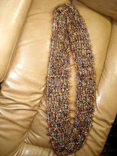 Infinity scarf in shades of brown, gold, and blue