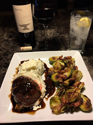 Rare grilled prime petite filet mignon, mashed potatoes with Merlot reduction and bacon roasted Brussels sprouts