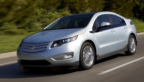 Front 3/4 view of silver 2011 Chevrolet Volt driving on highway