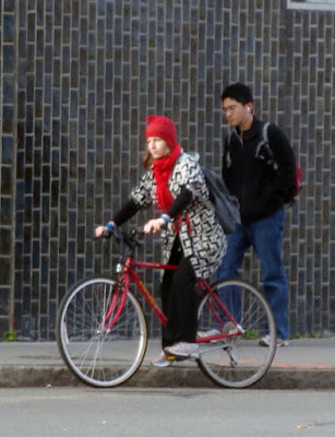 black and white jacket red bike