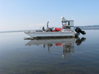 Dewey's boat, the clamdango, bringing his tractor back to land