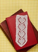 http://www.letsknit.co.uk/free-knitting-patterns/dainty-bookmark