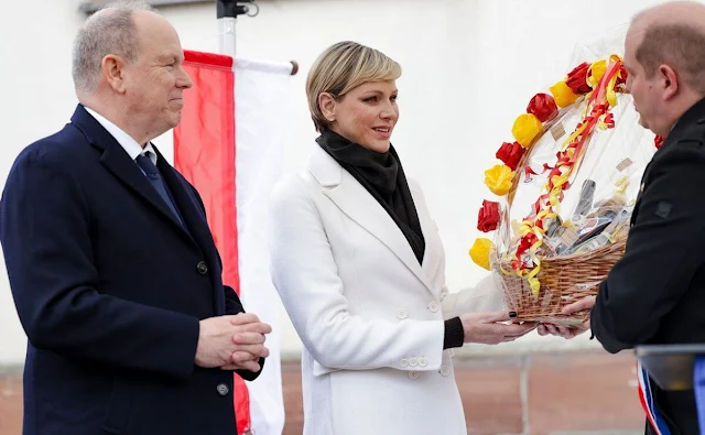 Princess Charlene wore a white wool and cashmere double breasted coat by PAROSH. Haut-Rhin in Alsace. Jeanne de Ferrette