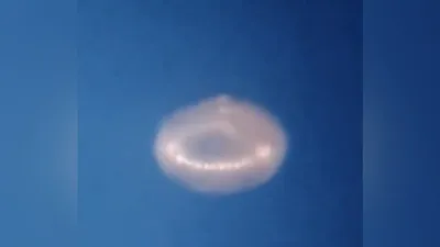 Cloud like UFO filmed over the USA looks like a orange ring inside.