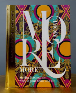 MORE MORE MORE by author Laurence Llewelyn-Bowen: book cover featuring a gilded, embossed cover with a glorious design scheme of typography superimposed over wallpaper style extravagence