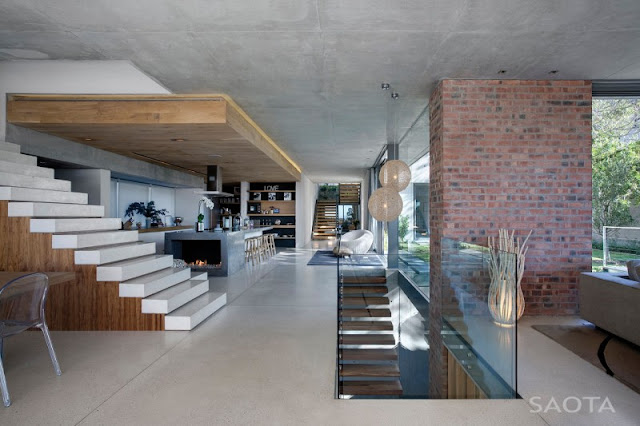 Photo of interiors of the Glen House showing modern kitchen along with the staircase to the fist floor and down to the basement