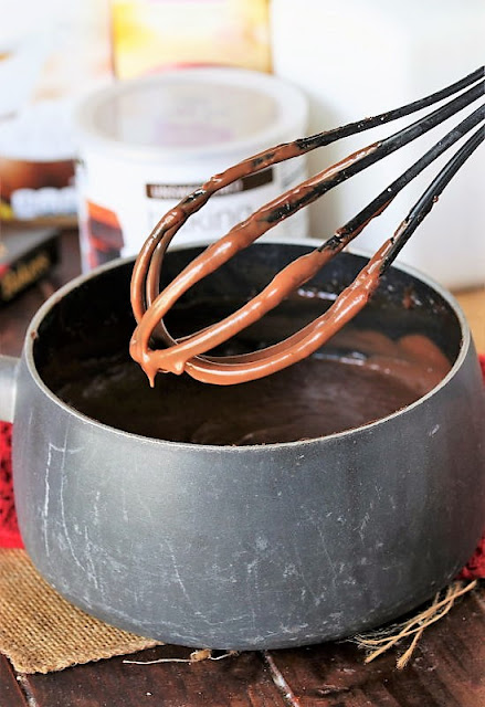 Whisking Homemade Chocolate Pudding Image