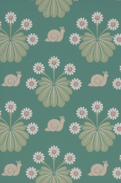 A green wallpaper design with daisies and snails.