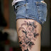 Cluster of Flower on Women Thigh Tattoo Designs