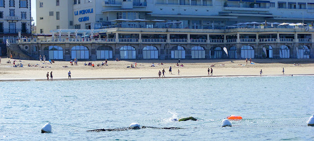 Swimming across the bay at Saint Jean de Luz. Pyrenees-Atlantiques. France. Photographed by Susan Walter. Tour the Loire Valley with a classic car and a private guide.
