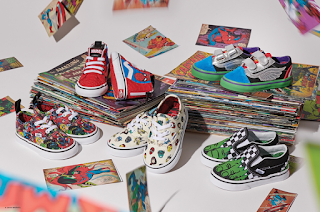 A birds eye group shot of several pairs of Vans including classic red and white Vans, red and black vans, red vans with small white detailing, silver and light blue Vans and white slip-ons with animated detailing of Avengers on a white background. 