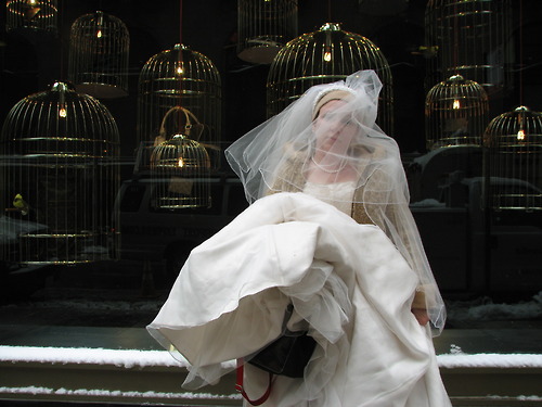  costume display showing historic wedding dresses from the 1900s through 