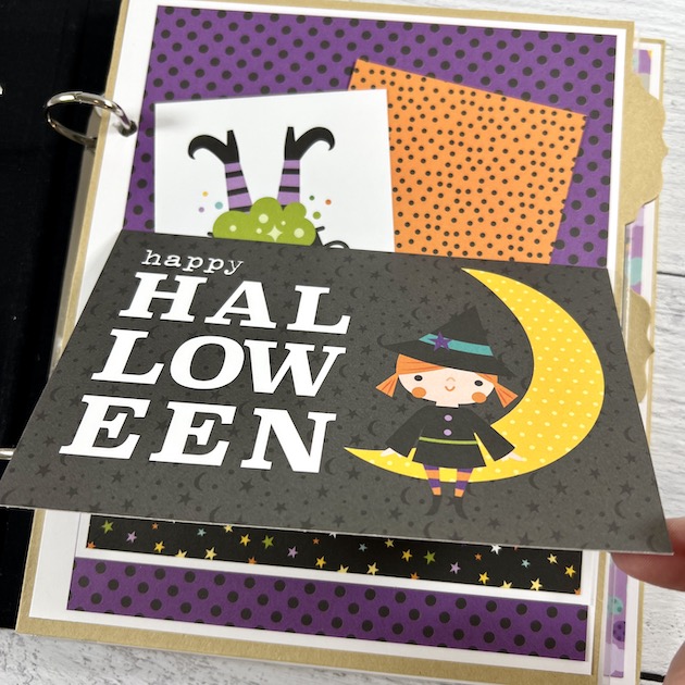 Halloween scrapbook album page with witch card and pocket for holiday photos