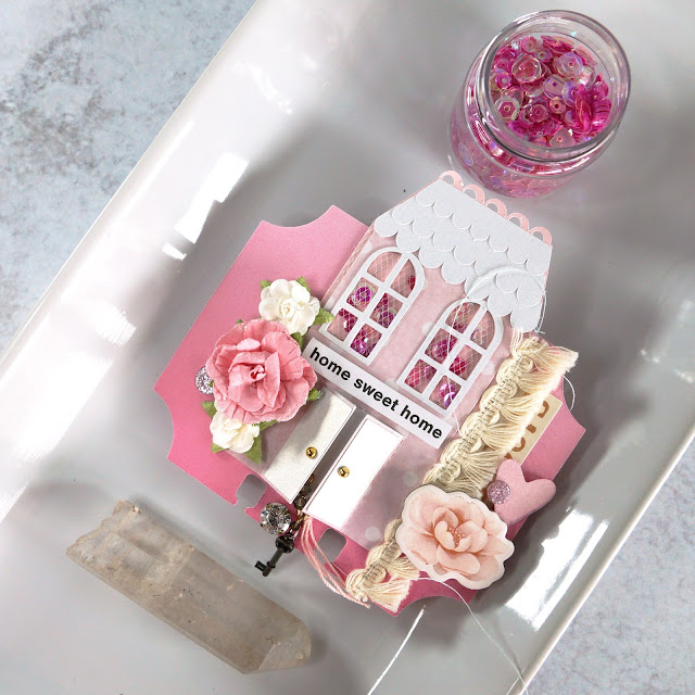 Heidi Swapp Memorydex Valentine's advent calendar made with the Prima With Love collection by Frank Garcia; miniature mini house shaker die cut with tag decorated with ephemera, stickers, paper flowers, tassel trim, tulle, sequins and charms