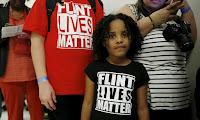 Flint residents attend a congressional hearing about the water crisis in their Michigan city. (Photograph Credit: Kevin Lamarque/Reuters) Click to Enlarge.