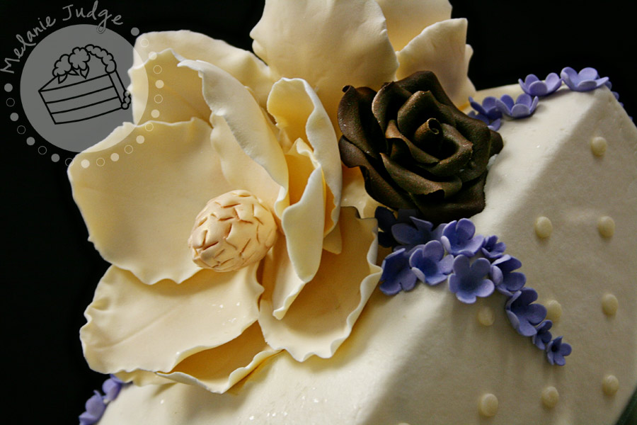 This particular wedding cake had ivory magnolias chocolate brown roses 