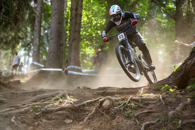 Jack Reading during downhill race competition skipping the roots.