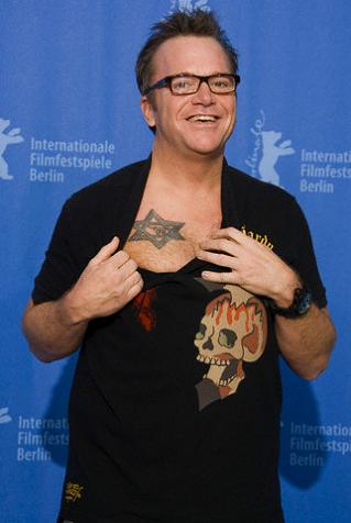 A man showing his Jewish symbol star tattoo on the chest