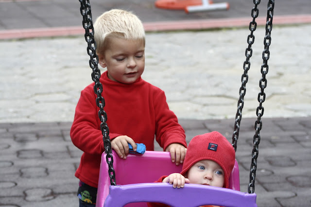 Anton pushing Neve on the swing.