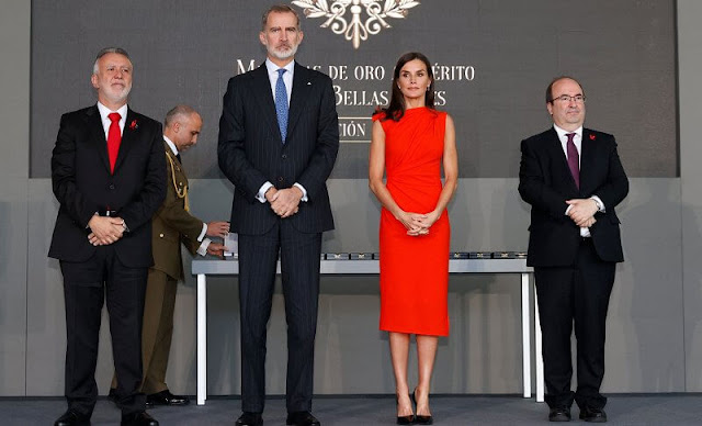 Queen Letizia wore a red orange gathered midi dress made of wool blend fabric by ZARA x Narciso Rodriguez