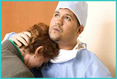 Doctor Consoling Patient Relative