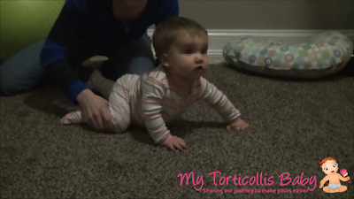 Mom helping baby with crawling exercise