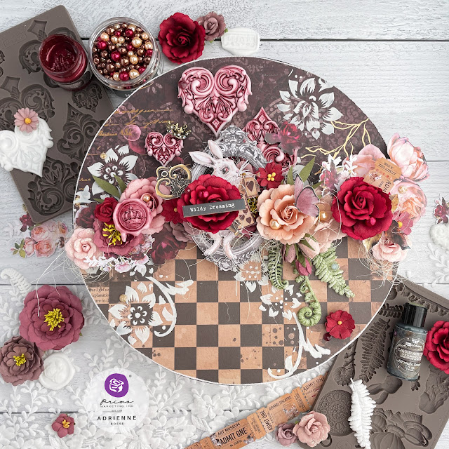 Queen of Hearts inspired mixed media art on a 12 inch wooden circle, decorated with Prima Marketing Lost in Wonderland ephemera, papers, flowers and moulds; as well as with Finnabair art mediums.