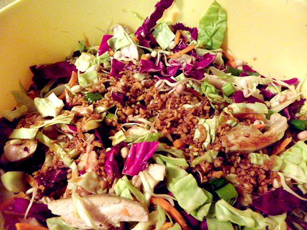 Large Bowl of Salad Topped with Ginger Dressing