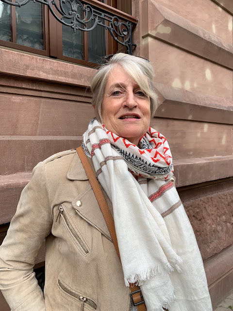 Woman in suede jacket and scarf