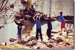 boys-throwing-rocks-in-rive