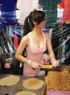 Cindy "The Peanut Ice Cream Crepe Maker"  "Popiah"  If you are looking for some kind of delicious crepe, just try this Taiwanese street food ice cream popiah. You can watch how to prepare this crepe by this sweet-looking girl while waiting for it.