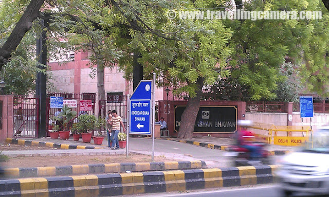 Lalit Kala Academy, New Delhi, INDIA : Last month when I was roaming around National School of Drama and Kamani to find out sources for getting tickets for Summer Theatre Festival, I saw a building with a huge poster outside about a Painting Exhibition... This building was on Ferozeshah Road and it was known as Lalit Kala Academy... Let's see what it is and how it looks... I had heard a lot about Lalit Kala Academy through my friends and Delhievents.com ... Now suddenly I figured out the location. When I was passing by the building, I had no time as my agenda was to get tickets for all the shows in Summer Theatre Festival and there were some fixed timings for getting the tickets...After getting tickets and meeting some folks at National School of Drama, I came back to Lalit Kala Academy... It's just a 5 minutes walk from National School of Drama and 10 Mins walk from Mandi-House Metro station !!!The Lalit Kala Akademi or National Academy of Arts is India's National Academy of Art. It was established at New Delhi in 1954 by Government of India to promote and propagate understanding of Indian art, both inside and outside the country. It does so through providing scholarships, a fellow program, and sponsoring and organizing numerous exhibitions in India and overseas. It is funded by the Ministry of Tourism and Culture, and is an autonomous organization.This area around Lalit Kala Academy, National School of Drama and Kamani is awesome... Green area and during may-june, these yellow flowers make it more beautiful...Doordarshan Office is just opposite to Lalit Kala Academy and the day I visited Lalit Kala Academy, Vinod Dua was also roaming there with his friends !!!Full view of Delhi Doordarshan Office and it's also visible form National School of Drama !!!A painting exhibition was going on when I visited Lalit Kala Academy in New Delhi... This was first time, I was able to appreciate the paintings hanging on the walls of Lalit Kala Academy Halls.... Most of the times I have seen abstract paintings in IHC and other places, but could not relate to cost of those art-pieces... probably because, recently one of my friend has started telling me about the techniques used in Painting.This was huge hall with full of Tagore Paintings and some metal art-pieces in the middle of this hall !!!The Lalit Kala Akademi (National Academy of Fine Art) is the premier fine art institution of the Government of India to promote, spread and develop Indian fine art culture. It is a non-profit, autonomous body, funded by the Ministry of Tourism and Culture. In pursuance of its role, Lalit Kala Academy holds exhibitions, institutes scholarships, sponsorships, fellowships, assistance schemes, Lifetime Achievement Awards, and publishes documentary material. It also conducts Trienale India, and the National Exhibition of Photography and Art.Some of the paintings were very lively and some had amazing 3D effect...The Lalit Kala Akademi was inaugurated in New Delhi on August 5th, 1954, by the then Minister for Education, Maulana Abul Kalam Azad. The youngest of the three Akademies founded by the Government of India, the Lalit Kala Akademi was established in pursuance of the dream of the first Prime Minister of independent India, Pandit Jawaharlal Nehru for a cultural and national identity. Thus the Lalit Kala Akademi as one among three such national organizations, that emerged. The Lalit Kala Academy was the principal establishment to direct its focus on activities in the field of visual artsIt seems there are multiple exhibition halls in Lalit Kala Academy but it was under renovation during that day... So I was not able to explore it completely....Wonderful path around the ferozshah road in front of Lalit Kala Academy... This connects Lalit Kala Academy with Kamani Auditorium !!!Next to Lalit Kala Academy is Sangeet Natak Academy which was closed, I don't know why...Maulana Abul Kalam had stated:“…The Akademi must work to preserve the glorious traditions of the past and enrich them by the work of our modern artists.  It must also seek to improve standards and refine public taste...” ... And I hope it will continue to do so !!!Check out more about Academy at http://lalitkala.gov.in/ 