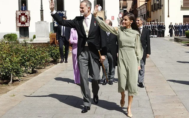 Queen Letizia wore a Nanda sage green polka-dot dress by Vogana. Carolina Herrera neutral leather slingback pumps