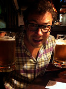 Adam in a Bavarian beer hall with, gasp . not one but two beers in hand. (img )