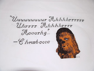 Chewbacca cross-stitch portrait with "quote"
