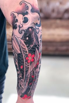 black-koi-fish-forearm-tattoo