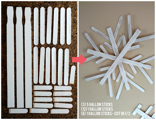 Use paint sticks from a hardware store and some paint to make these fun and rustic snowflakes for your home!  I made 3 of them for less than $4!