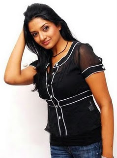 Actress Vimala Raman in Black Top and Designer Jeans