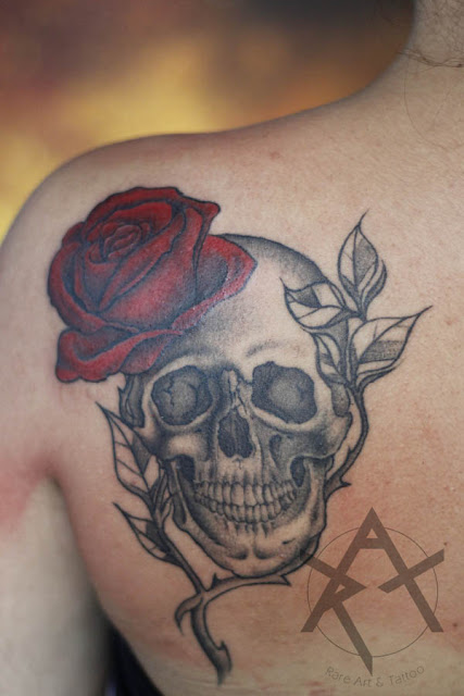 Skull and rose black work and red tattoo