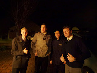 Missionaries from The Church of Jesus Christ of Latter Day Saints carolling together
