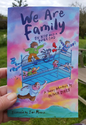 We are family by oliver sykes book cover showing kids on a bunk bed being held aloft by a flying Dad