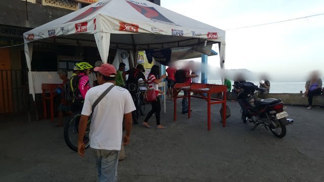 guimaras-bound passengers registering on the passenger manifests at the Iloilo Ortiz Wharf