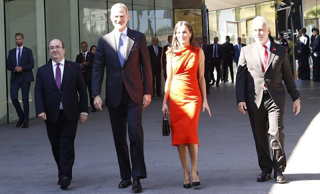 Queen Letizia wore a red orange gathered midi dress made of wool blend fabric by ZARA x Narciso Rodriguez