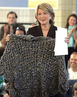 Martha Stewart holding the Poncho of Shame