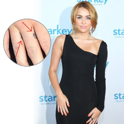 TATUAJE TATTOO SIMBOLO DE LA PAZ MILEY CYRUS FAMOSOS