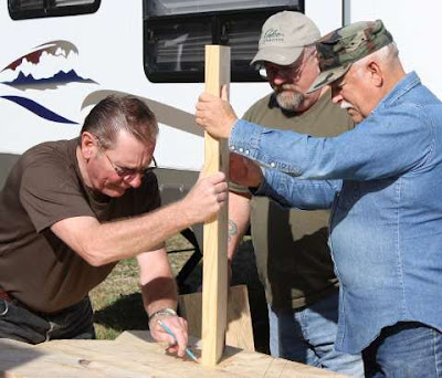 Photo of Rob, John, and Ted building steps.