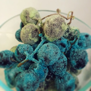 Black grapes covered in sour instant gelatin.  Such a yummy Treat!  Tastes even better than Sour Patch Kids!